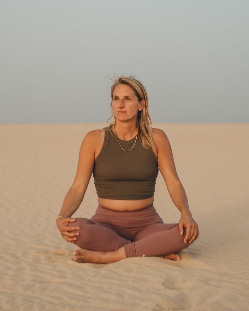 Anke meditating on the dunes in Fuerteventura