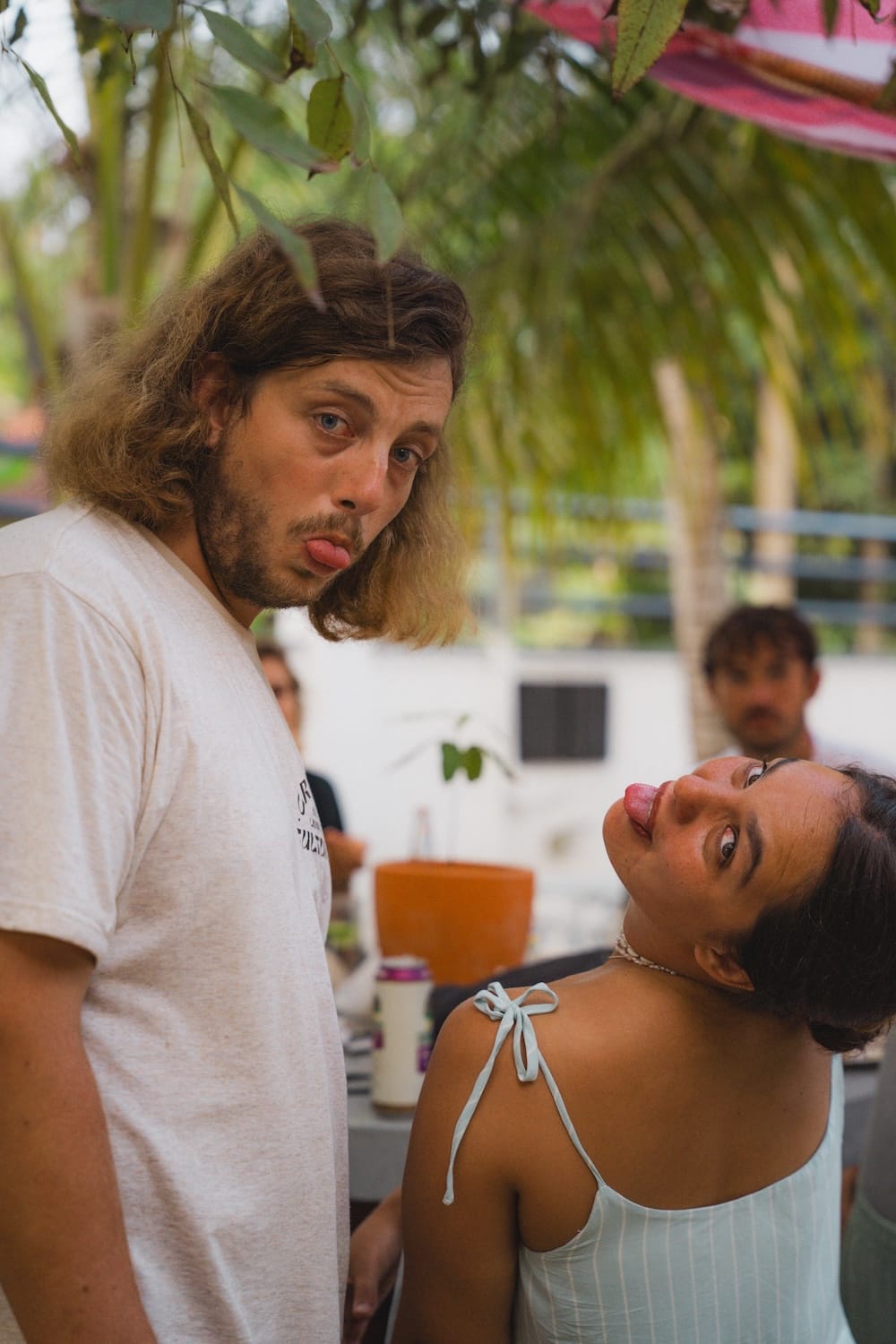 Kelani team goofing around at a garden party